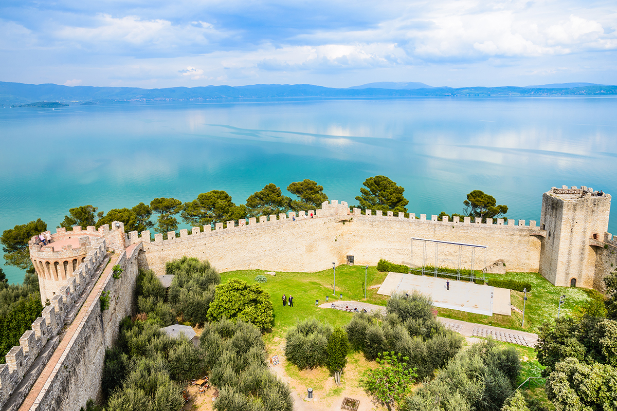 The brilliant blue waters of Lake Trasimeno visible from Castiglione del Lago