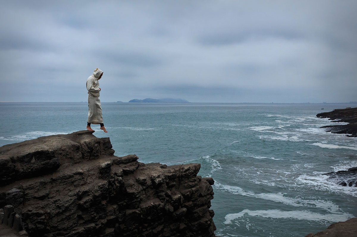 A brotherhood of friars and 100's of victims were lost through the chilling violence of one gang A friar stands on the rocks overlooking the sea