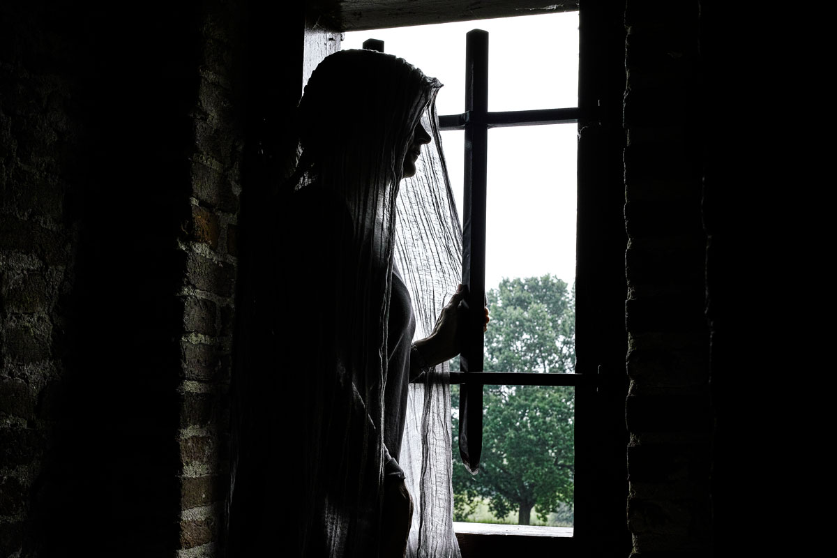 The sad wife waits for her husband, by the window of Palazzo Budini-Gattai
