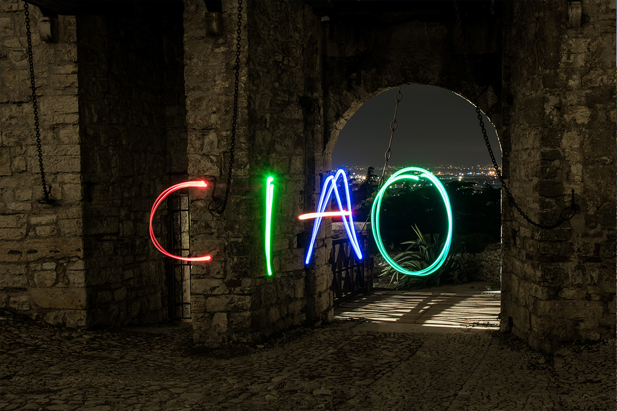 A colourful set of sparklers inscribe 'Ciao' in the night sky