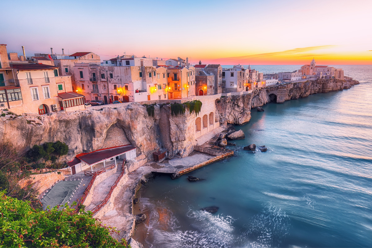 Vieste's white-washed houses perched on the promontory surrounded by the Adriatic sea.