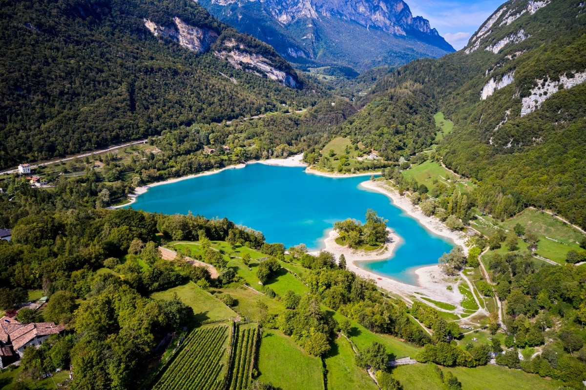 Aerial view of the turquoise and swimmable Lago di Tenno in proximity to Riva del Garda, Arco and Torbole sul Garda
