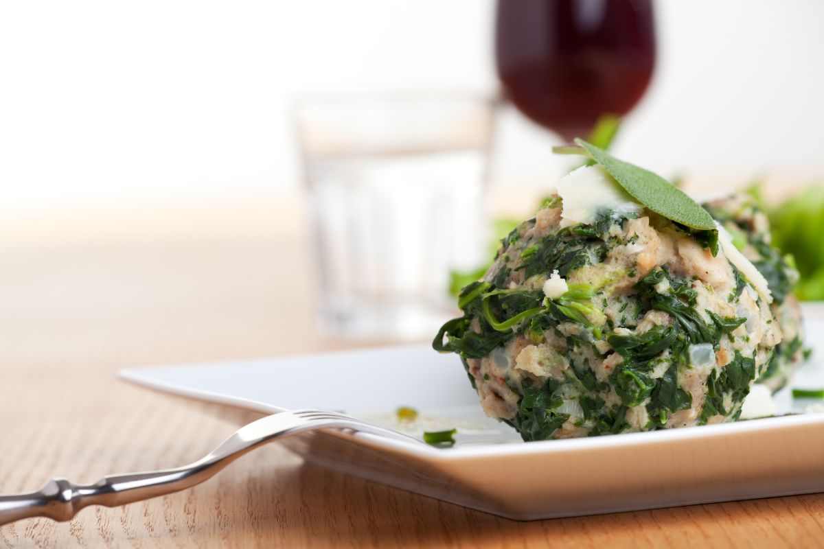Strangolapreti, a sumptuous Italian dumpling with spinach and a popular local dish in the Trentino-Aldo Adige region