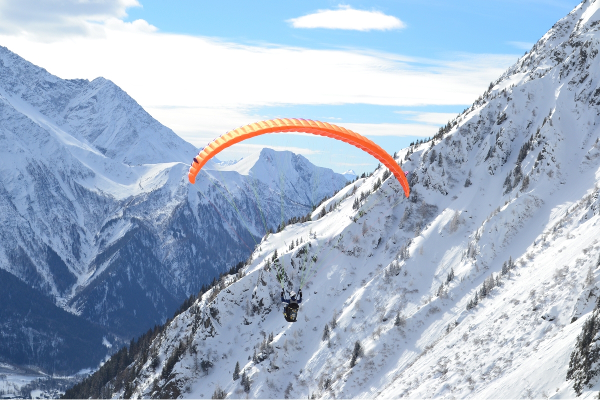 Paragliding in the snowy mountains of Chamonix-Montblanc