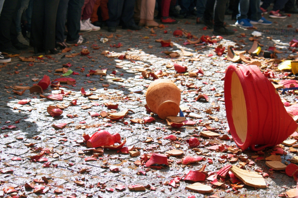 Smashed pottery in the street of Corfu, with the public attending
