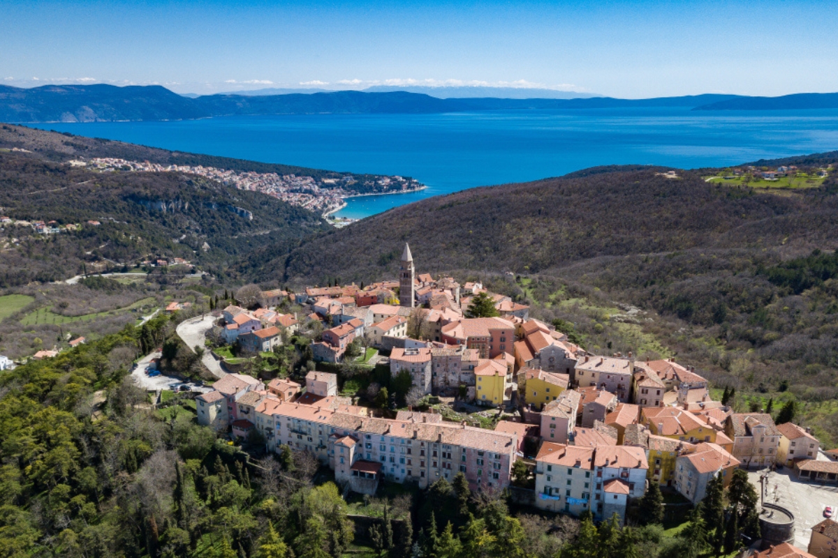 Aerial shot of the Croatian town Labin with a beautiful background featuring the town of Rabac