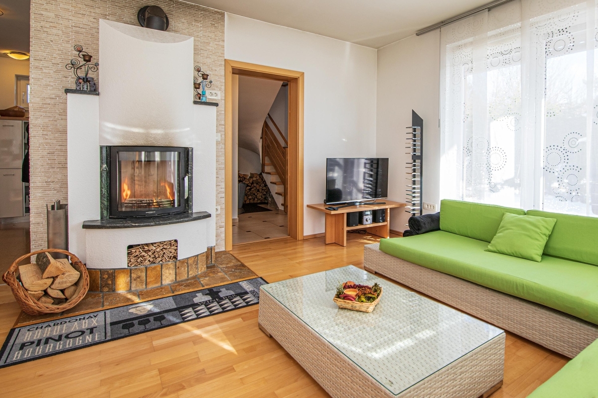 Cosy living room, with parquet, sofa and fireplace