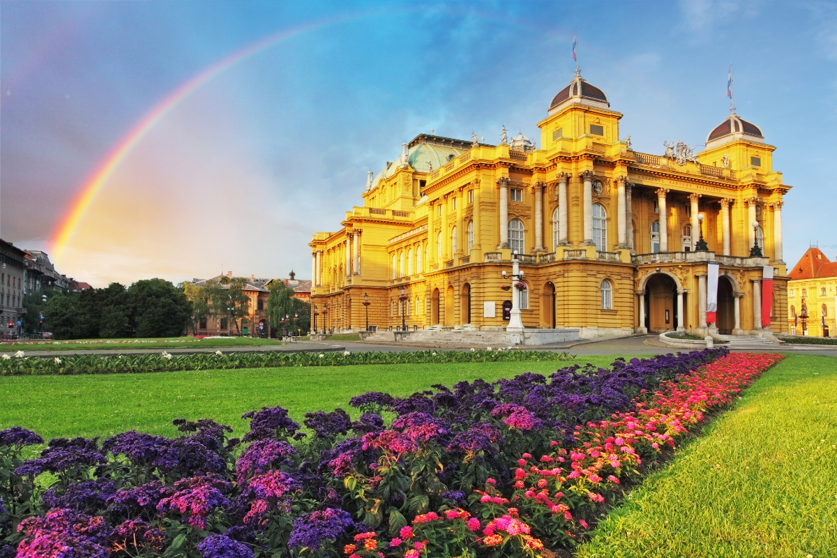 The stunning Croatian National theatre in Zagabria, with rainbow on the background