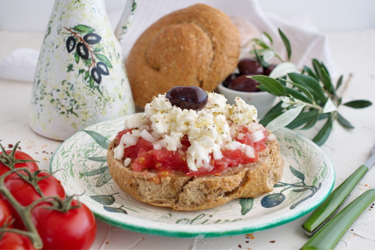 Dakos, a juicy Greek appetizer with tomatoes and Feta cheese