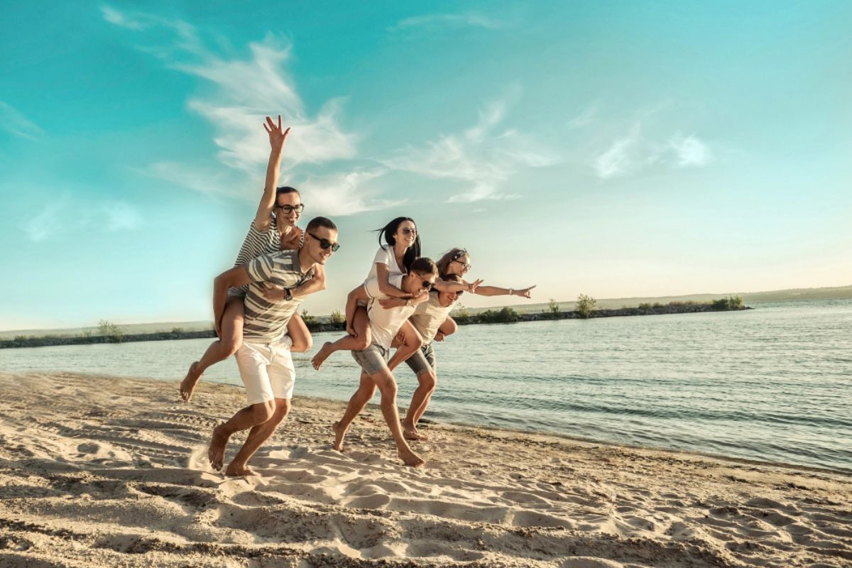 Friends enjoy themselves on the sunny beach