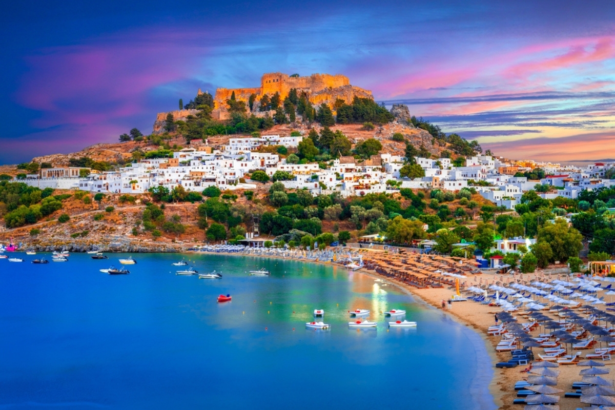 Lindos city on Rhodes island, Greece. Small whitewashed village and the Acropolis, on Rhodos Island, Greece at Aegean Sea 