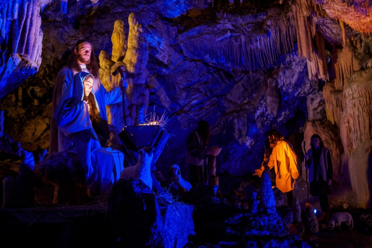 Live crib among the illuminated stalactites and stalagmites in Postojna cave at Christmas