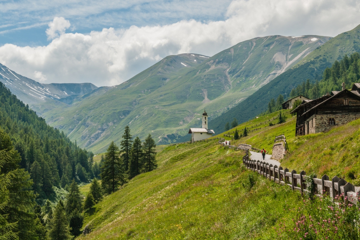 Stunning view of Livigno, Italy, Val Federia, mountain village and church