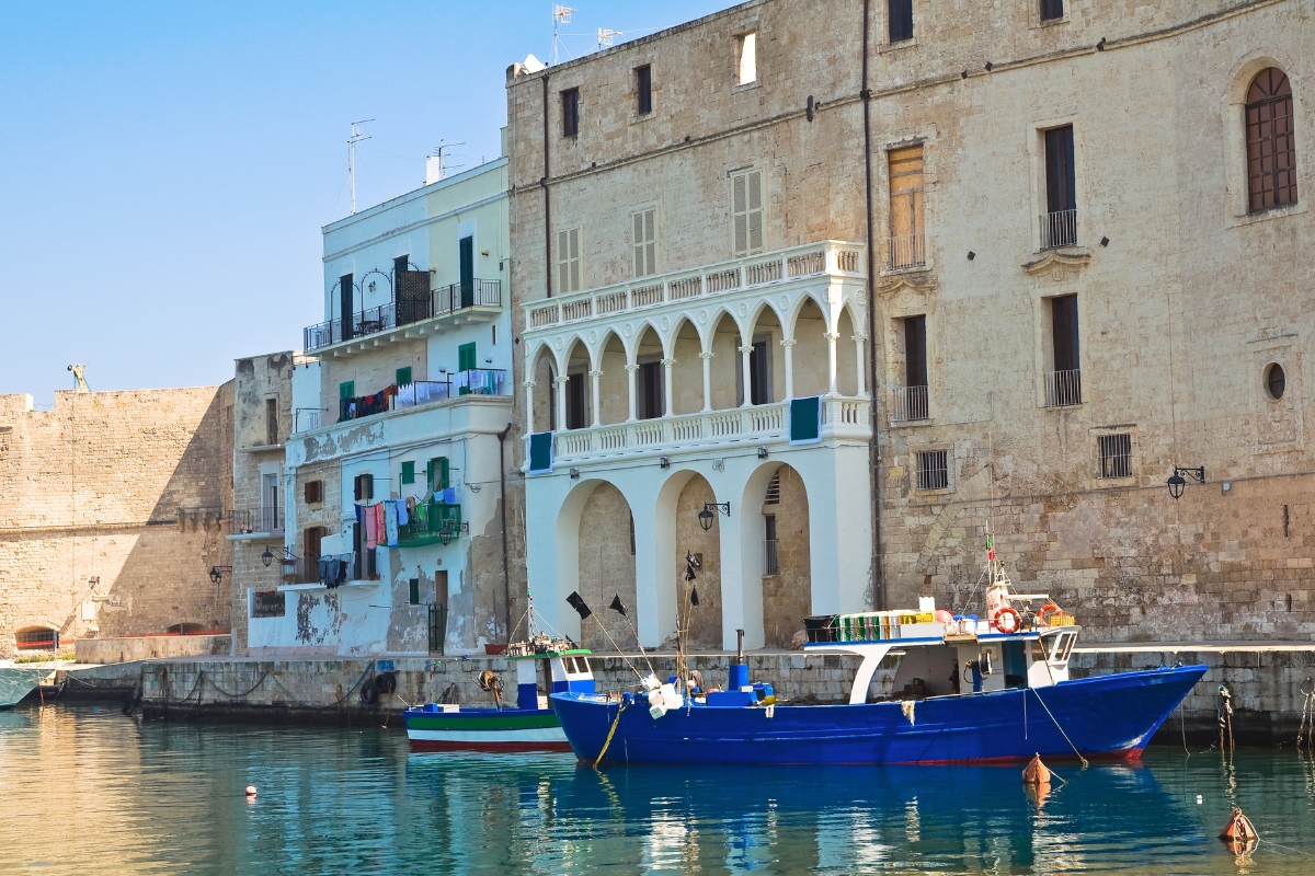 Monopoli's old port with traditional boats in the foreground