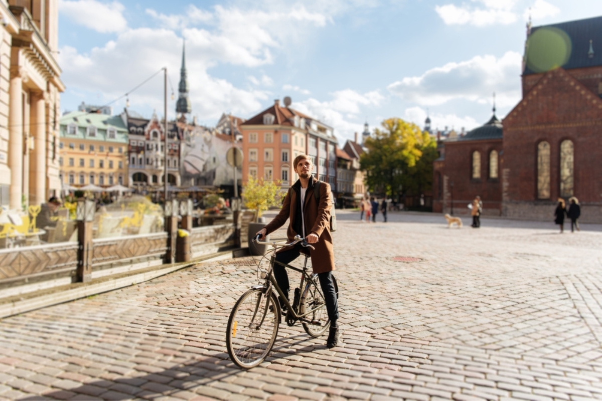Young man riding a bike. Sustainable mobility transport