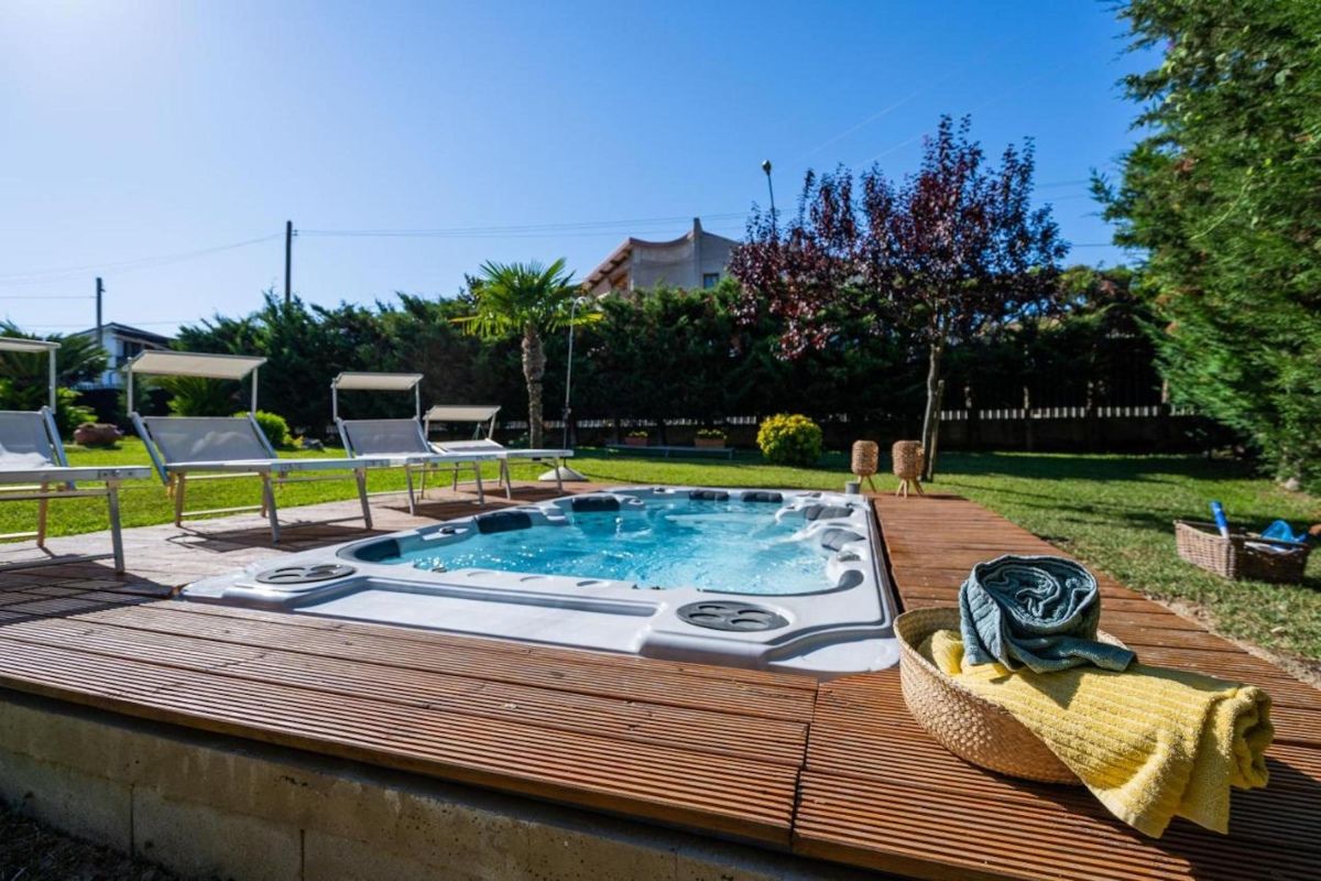 Outside hot tub in the garden on a sunny day