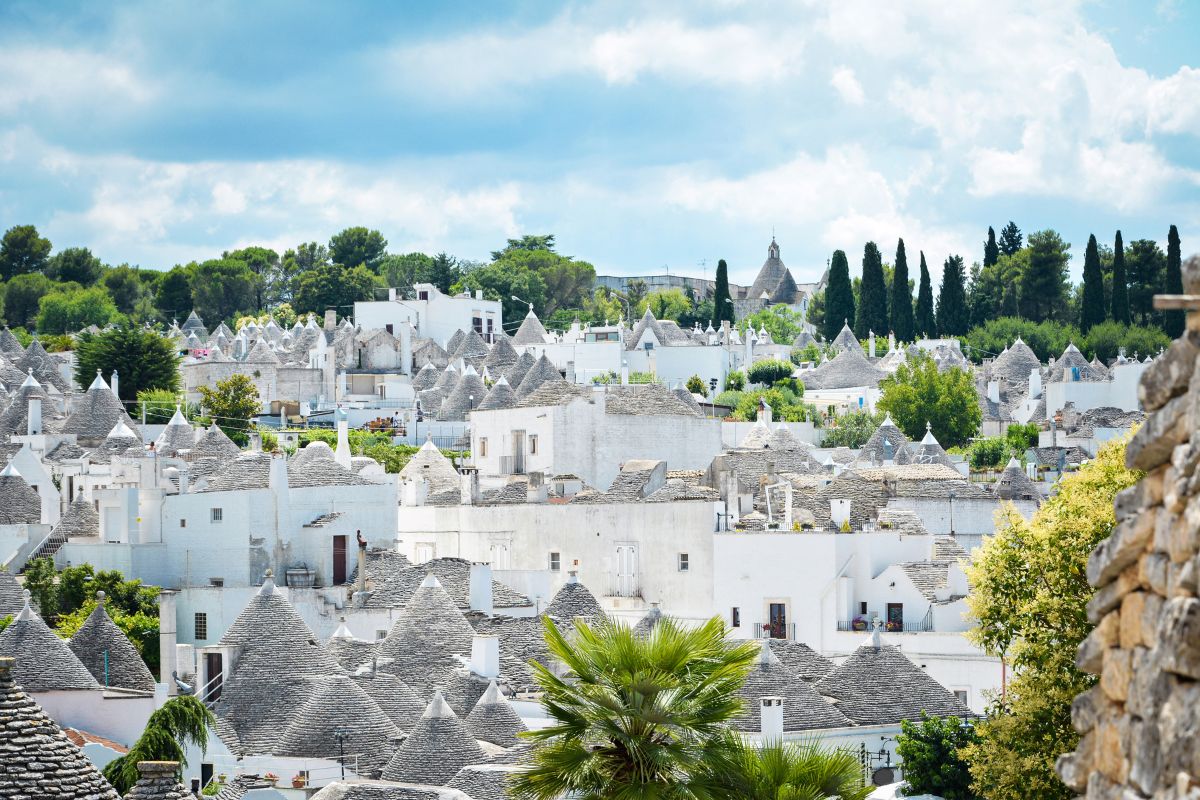 Scenic panoramic view of Alberobello town and its typical trulli buildings, Apulia, Italy
