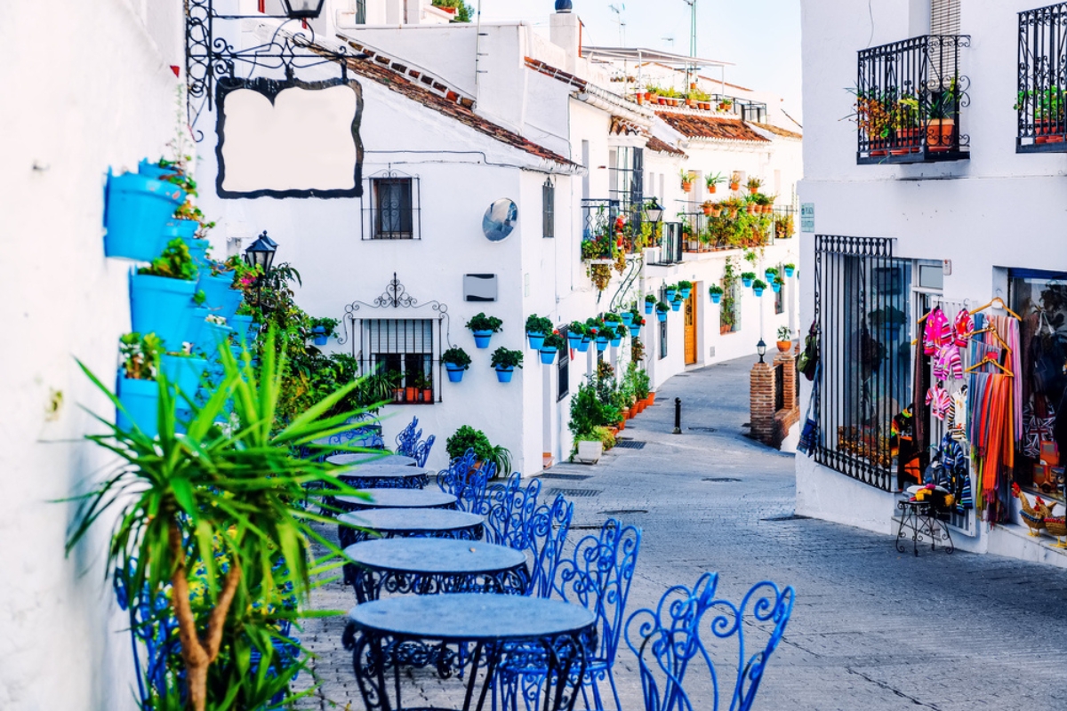 An alley with white-washed houses in Mijas, Andalucia, Spain