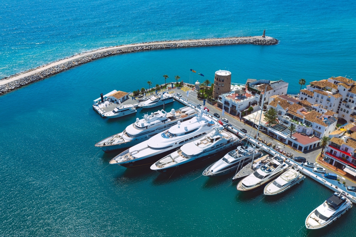 Aerial view of Puerto Banús lined with high-end yachts