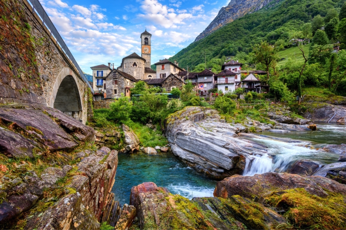 Traditional stone houses and a Church in the picturesque Lavertezzo village, Ticino, Switzerland. Lavertezzo is a popular travel destination in Verzasca valley in the swiss Alps mountains