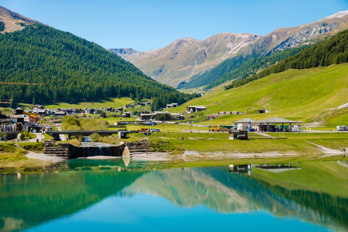 View across Lake Livigno to the sidewalk around the lake