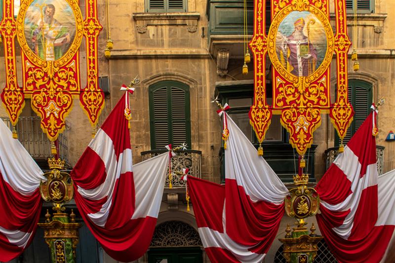  Bright banners outside Parish Church celebrating St.  Feast of St Paul's Shipwreck in Valetta, Malta. 